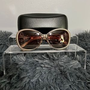 Beige sunglasses with cleaning cloth and zipper case.